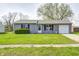 Charming single-story home with a well-maintained lawn and a cozy, inviting exterior at 6124 Dry Den Ct, Indianapolis, IN 46221