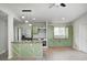 Modern kitchen with stainless steel appliances, custom island, and stylish lighting at 6124 Dry Den Ct, Indianapolis, IN 46221