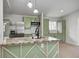 Close-up of a modern kitchen island, featuring a unique countertop and sleek faucet at 6124 Dry Den Ct, Indianapolis, IN 46221