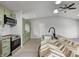 Bright kitchen with stainless steel appliances, green cabinets, a stylish island, and open layout at 6124 Dry Den Ct, Indianapolis, IN 46221