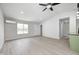Well-lit open living space with modern ceiling fan and easy access to the renovated kitchen at 6124 Dry Den Ct, Indianapolis, IN 46221