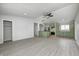 Bright living space that connects to the updated kitchen and features stylish flooring at 6124 Dry Den Ct, Indianapolis, IN 46221