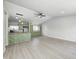 Open living space with vaulted ceiling, flowing into a renovated kitchen with new appliances at 6124 Dry Den Ct, Indianapolis, IN 46221