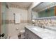 Beautiful bathroom featuring a glass shower door and marble countertop vanity sink at 6340 Bluebell Ct, Indianapolis, IN 46224