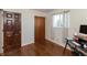 Bedroom with hardwood floors, a workstation, and window with natural light at 6340 Bluebell Ct, Indianapolis, IN 46224
