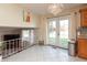 Bright dining area features chandelier, large tile flooring, and access to the backyard at 6340 Bluebell Ct, Indianapolis, IN 46224