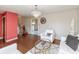 Bright living room showcasing a chandelier, large window, hardwood floors, and elegant decor for comfortable living at 6340 Bluebell Ct, Indianapolis, IN 46224