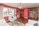 Bright living room showcasing a chandelier, large window, hardwood floors, and elegant decor for comfortable living at 6340 Bluebell Ct, Indianapolis, IN 46224