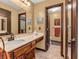 Bathroom featuring a vanity, toilet, and doorway that leads to another room at 641 Beech W Dr, Plainfield, IN 46168