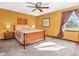 Bedroom with ceiling fan, natural light, and a cozy atmosphere for relaxation at 641 Beech W Dr, Plainfield, IN 46168