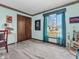 Bedroom with light walls, large closet, natural lighting, and complimentary decorations at 641 Beech W Dr, Plainfield, IN 46168