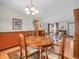 Open dining area with wooden table, chairs, and hardwood floors, adjacent to the living area at 641 Beech W Dr, Plainfield, IN 46168