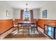 Bright dining room with traditional furnishings, a wooden table set, and a cozy rug at 641 Beech W Dr, Plainfield, IN 46168