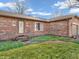 Close-up of brick home showcasing tidy landscaping and welcoming entrance at 641 Beech W Dr, Plainfield, IN 46168