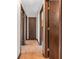 Hallway features wood floor and traditional doors, providing access to various rooms at 641 Beech W Dr, Plainfield, IN 46168
