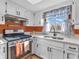 A cozy kitchen featuring white cabinets and modern appliances, filled with natural light at 641 Beech W Dr, Plainfield, IN 46168