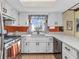 A bright kitchen offers white cabinets, modern countertops, and stainless steel appliances at 641 Beech W Dr, Plainfield, IN 46168
