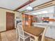 Kitchen and dining area with neutral tones and tile floor at 641 Beech W Dr, Plainfield, IN 46168