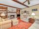 Living room boasts a fireplace, built-in bookshelves and classic decor at 641 Beech W Dr, Plainfield, IN 46168