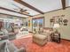 Open-concept living area with natural light, comfortable seating, and kitchen access at 641 Beech W Dr, Plainfield, IN 46168