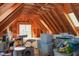 Unfinished attic space with exposed wood rafters, storage bins, and a cat tree at 649 E Country Ln, Martinsville, IN 46151