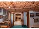 Basement features an open floor plan, wood ceiling, and a fireplace in the distance at 649 E Country Ln, Martinsville, IN 46151