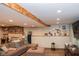 Basement area with fireplace, tv, shelving, and comfortable sectional couch at 649 E Country Ln, Martinsville, IN 46151