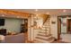 Inviting basement with finished wooden beams and steps leading to a functional entertaining space at 649 E Country Ln, Martinsville, IN 46151