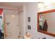 Modest bathroom featuring a shower/tub, toilet, and mirror at 649 E Country Ln, Martinsville, IN 46151