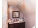 Bathroom vanity area featuring pink walls, a dark wood cabinet, and nice mirror at 649 E Country Ln, Martinsville, IN 46151