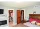Cozy bedroom featuring a closet, and a fireplace, with lovely brown and wood accents at 649 E Country Ln, Martinsville, IN 46151