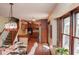 Open-concept layout seamlessly blends dining and kitchen, enhanced by natural light and stylish design at 649 E Country Ln, Martinsville, IN 46151