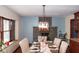 Cozy dining room featuring a unique light fixture and a stone fireplace, perfect for gatherings at 649 E Country Ln, Martinsville, IN 46151