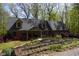 Brick home with dormers and beautiful landscaping at 649 E Country Ln, Martinsville, IN 46151