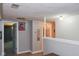 Hallway with artwork, lighting and view to other rooms at 649 E Country Ln, Martinsville, IN 46151