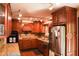 This kitchen boasts granite countertops and cherrywood cabinetry with stainless steel appliances at 649 E Country Ln, Martinsville, IN 46151