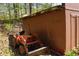 Exterior shot of an outbuilding showing the siding and tractor parked adjacent at 649 E Country Ln, Martinsville, IN 46151