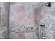 Nicely tiled shower featuring stones around the base and pink accent tiles at 649 E Country Ln, Martinsville, IN 46151