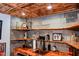 Basement wet bar features stone backsplash, wood shelves, and a convenient sink at 649 E Country Ln, Martinsville, IN 46151