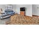 Cozy living room featuring neutral walls, a blue couch, and comfortable seating arrangement at 66 Coronado Rd, Indianapolis, IN 46234