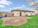 Brick patio area with a fenced yard, offering a private outdoor space adjacent to the home at 66 Coronado Rd, Indianapolis, IN 46234