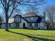 Charming two-story home featuring a well-manicured lawn, brick accents, and architectural details at 7211 Kensington Ct, Avon, IN 46123