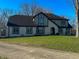Attractive exterior view showcasing the home's architectural style, windows, and lush front lawn at 7211 Kensington Ct, Avon, IN 46123