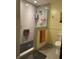 Modern bathroom with glass-enclosed shower featuring tile walls, bench, and upgraded fixtures at 7211 Kensington Ct, Avon, IN 46123