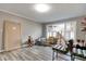 Versatile bonus room with wood-look floors and natural light, perfect for playtime or hobbies at 7525 N Meridian St, Indianapolis, IN 46260