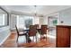 Elegant dining room with hardwood floors, a chandelier, and shuttered windows offering natural light at 7525 N Meridian St, Indianapolis, IN 46260