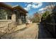 Charming home exterior featuring stone accents, wrought iron railings, and a covered porch at 7525 N Meridian St, Indianapolis, IN 46260