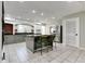 Open-concept kitchen features granite countertops, an island with seating, and modern appliances at 7525 N Meridian St, Indianapolis, IN 46260