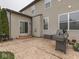 This house boasts a lovely stamped concrete patio with a grill and easy access from the sliding glass door at 7730 Imperial Eagle Dr, Zionsville, IN 46077