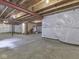 Unfinished basement with exposed ceiling, concrete floor, and walls covered in white plastic sheeting at 7730 Imperial Eagle Dr, Zionsville, IN 46077